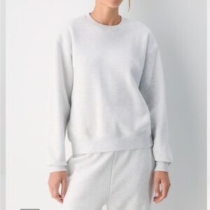 Aritzia cozy fleece sweatshirt in heather cloud white